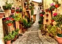 Papermoon Fototapete VLIES Premium "Gasse in Spello Umbrien" 3D-Effekt Bild 2