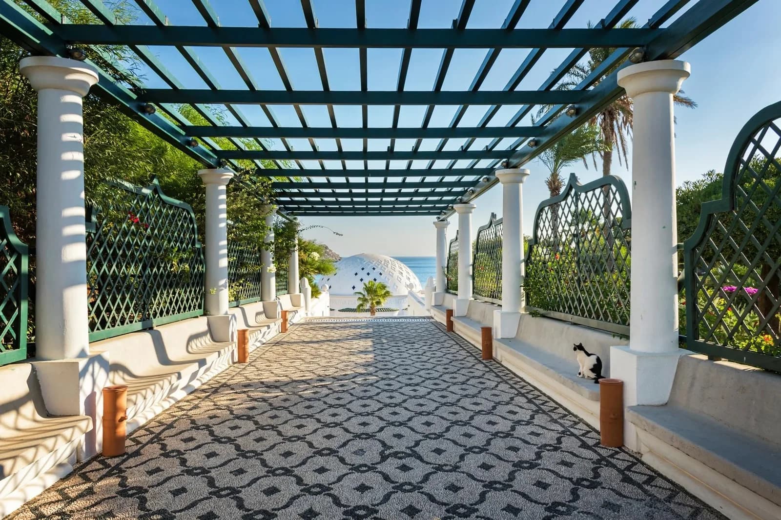 PAPERMOON Fototapete Pergola Rhodos Blumen Meer Palmen Vlies