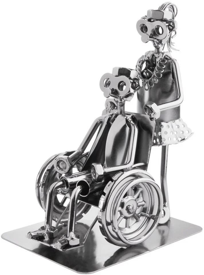 BRUBAKER Dekofigur Schraubenmännchen Pflegerin mit Rollstuhlfahrer Metallfigur
