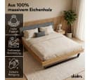 skølm Massivholzbett Alver Eiche mit gepolstertem Cord-Kopfteil Anthrazit Bild 1