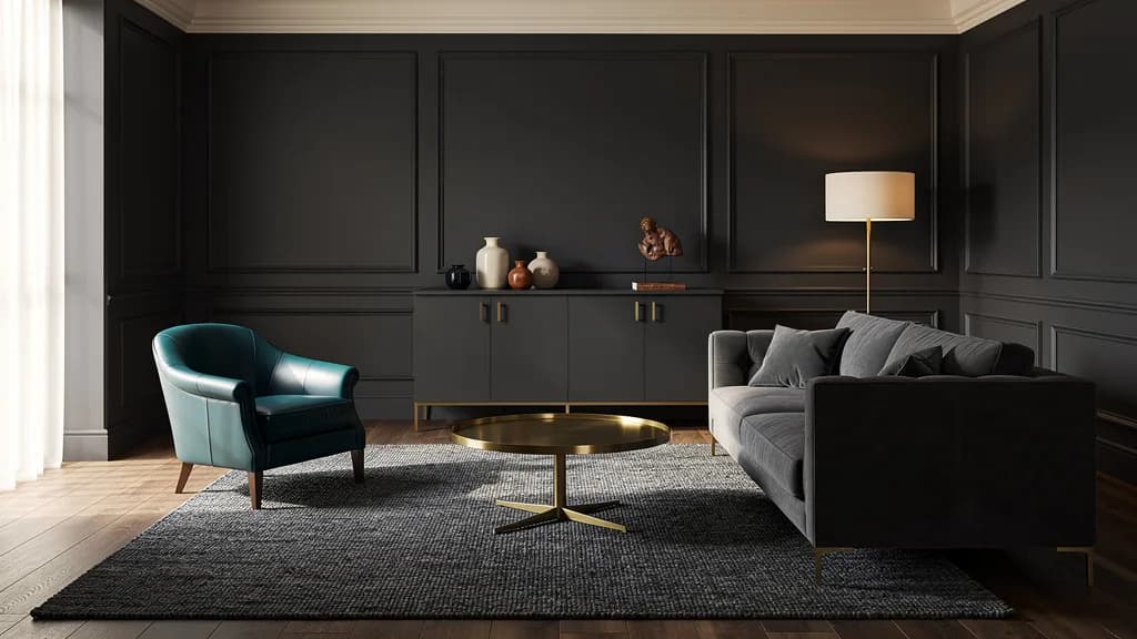 Dunkel-elegantes Wohnzimmer mit anthrazitfarbener Wandvertäfelung, grauem Sofa, petrolfarbenem Ledersessel und rundem Messing-Couchtisch.