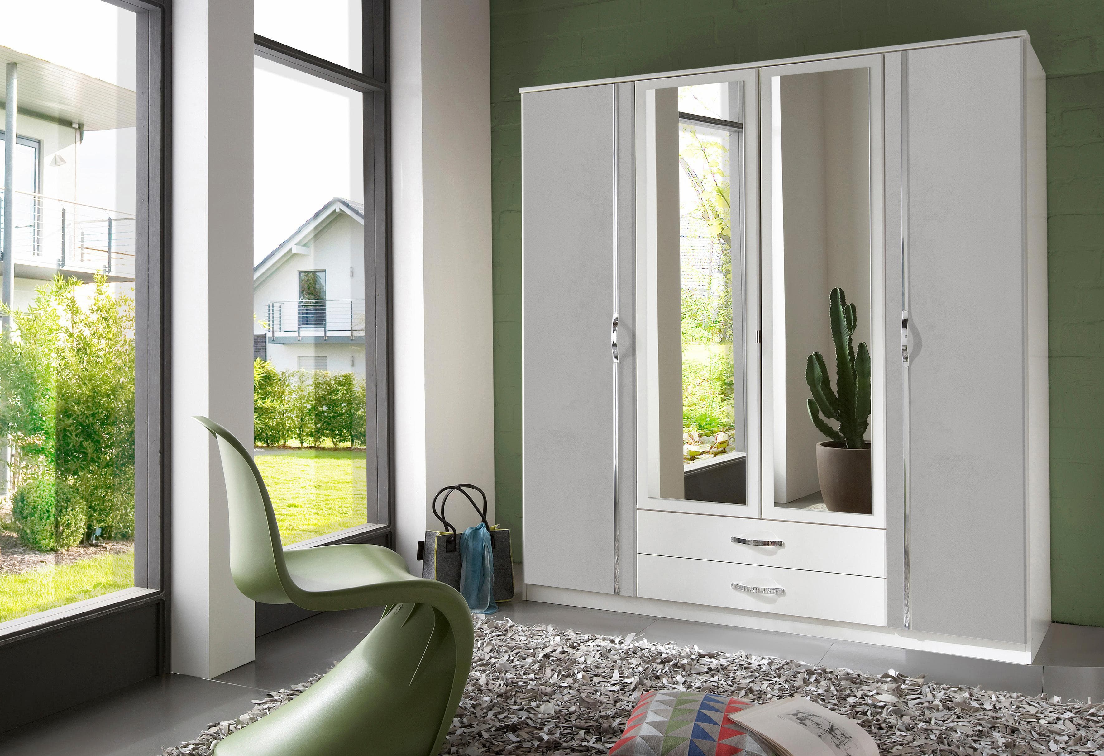 Weißer Drehtürenschrank mit Beton-Optik in Lichtgrau