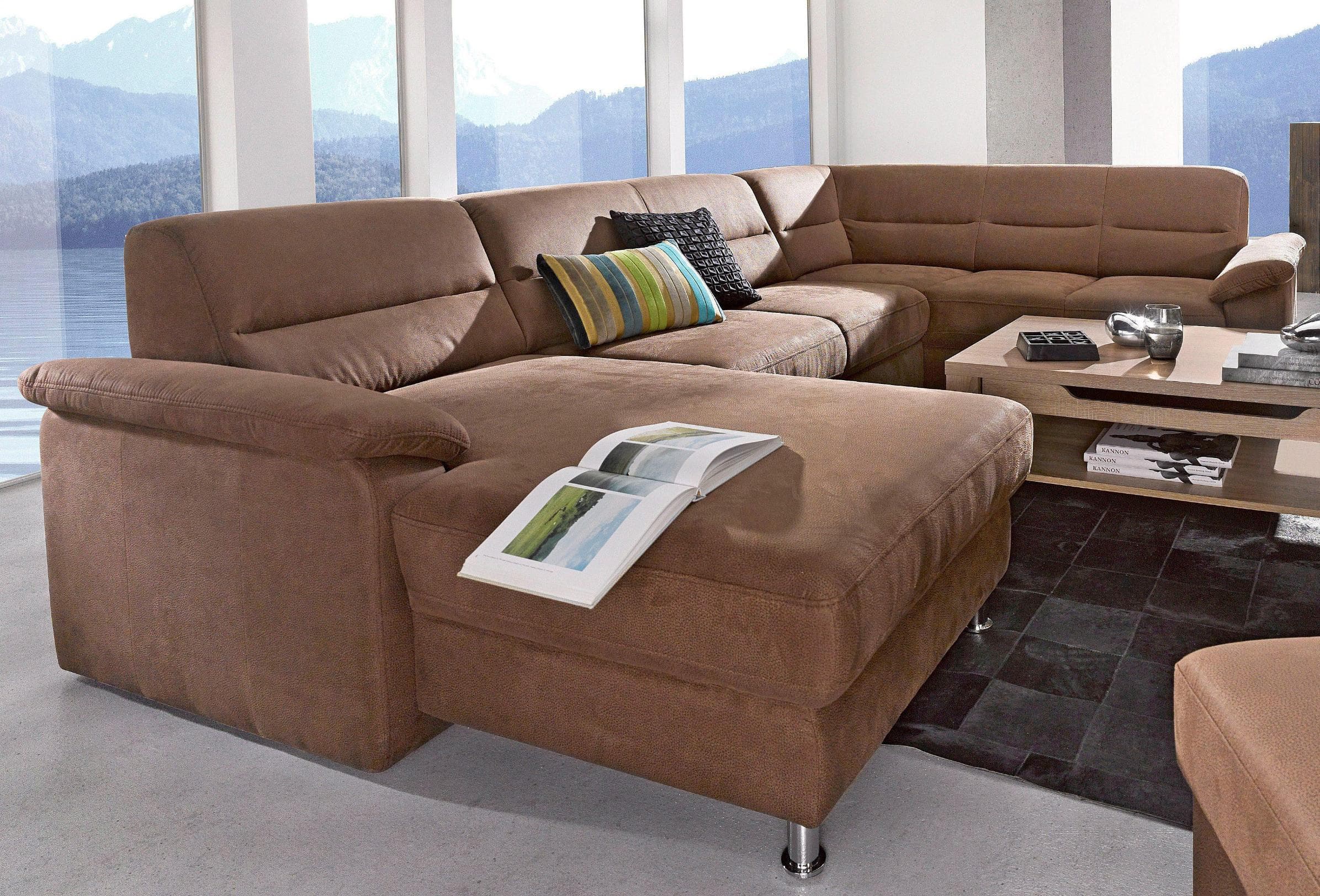 U-förmige Wohnlandschaft mit Boxspring-Polsterung und integrierter Bettfunktion