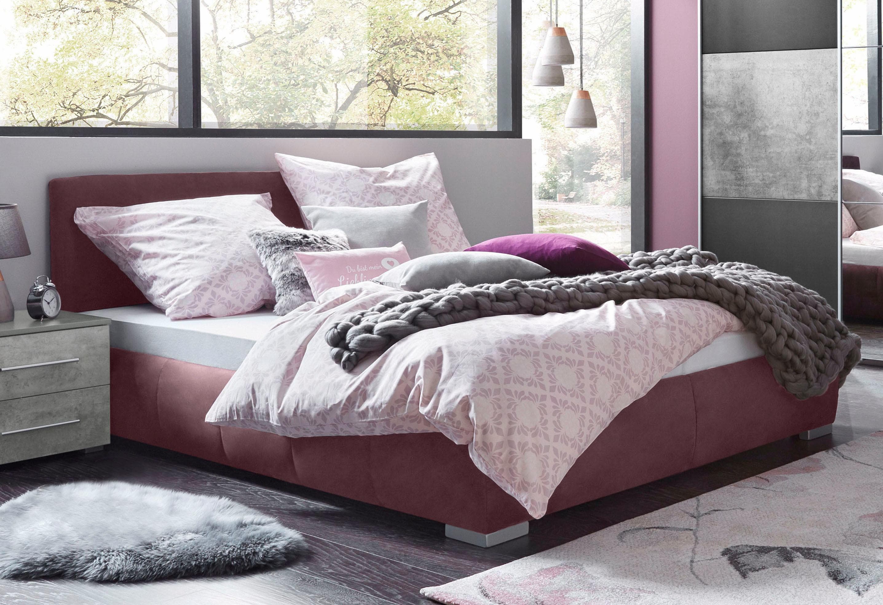 Polsterbett mit Bettkasten in Brombeer