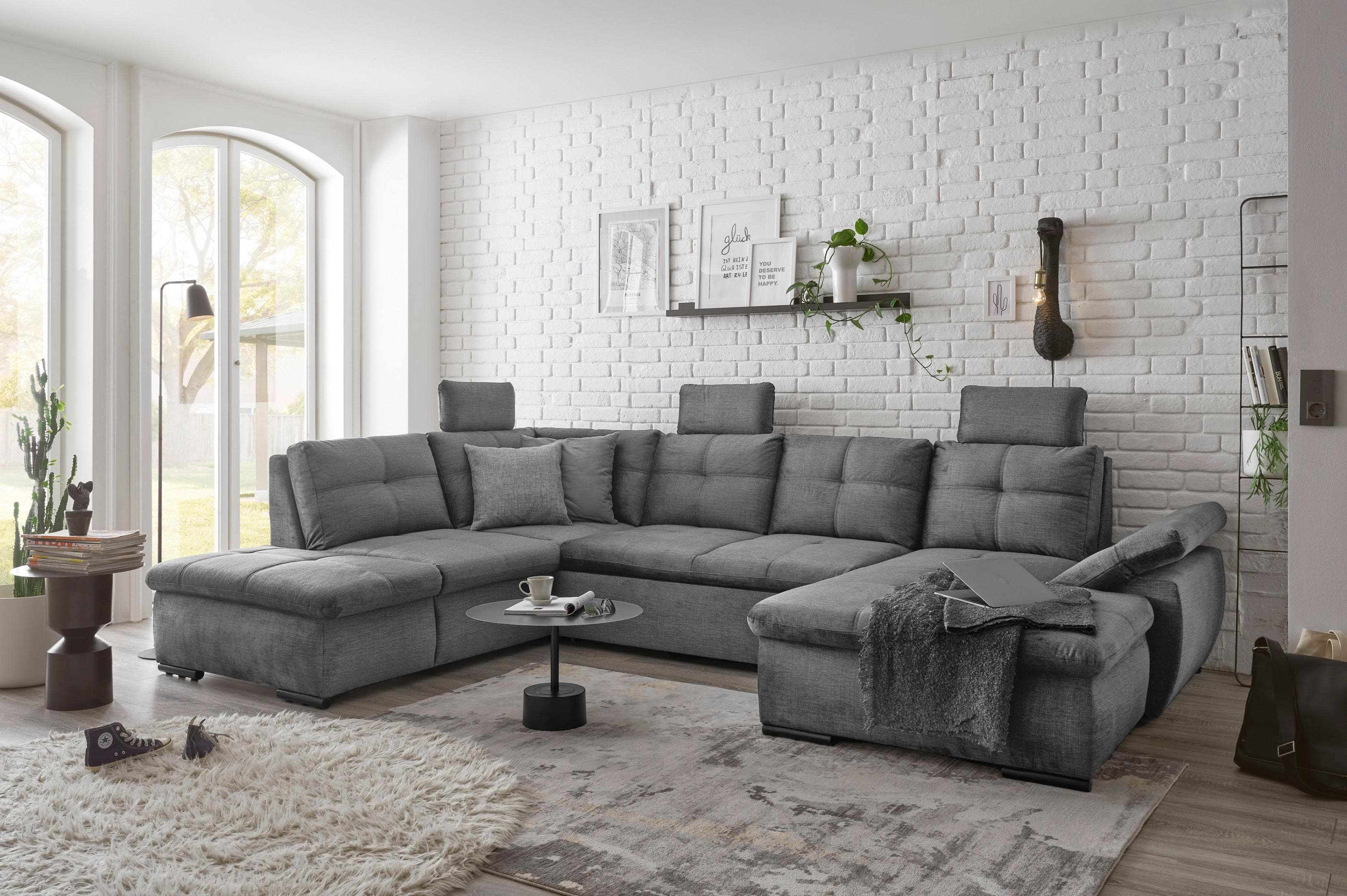 Graue Wohnlandschaft mit Schlaffunktion und 3 verstellbaren Kopfstützen