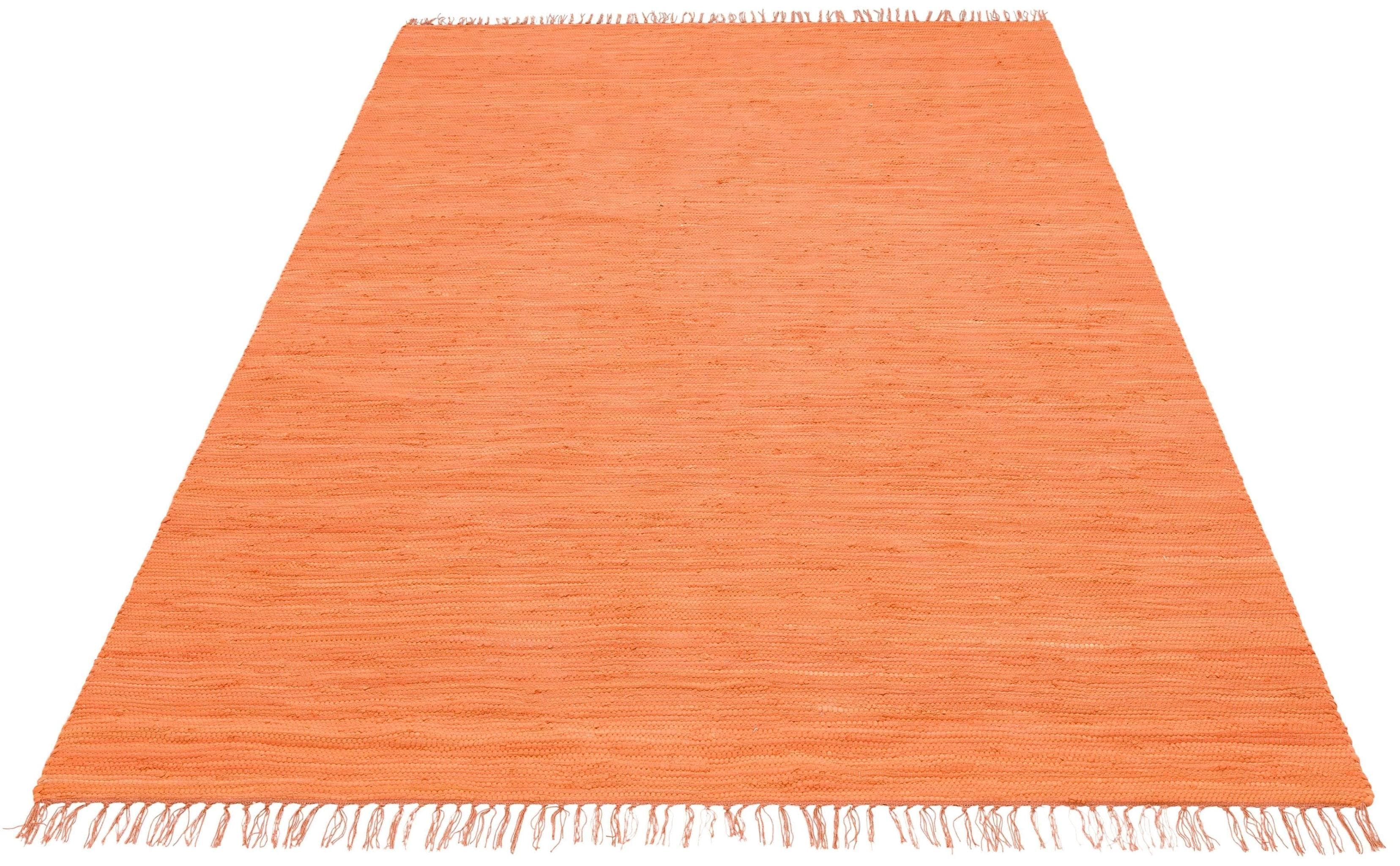 Orangefarbener Baumwollteppich im Landhausstil