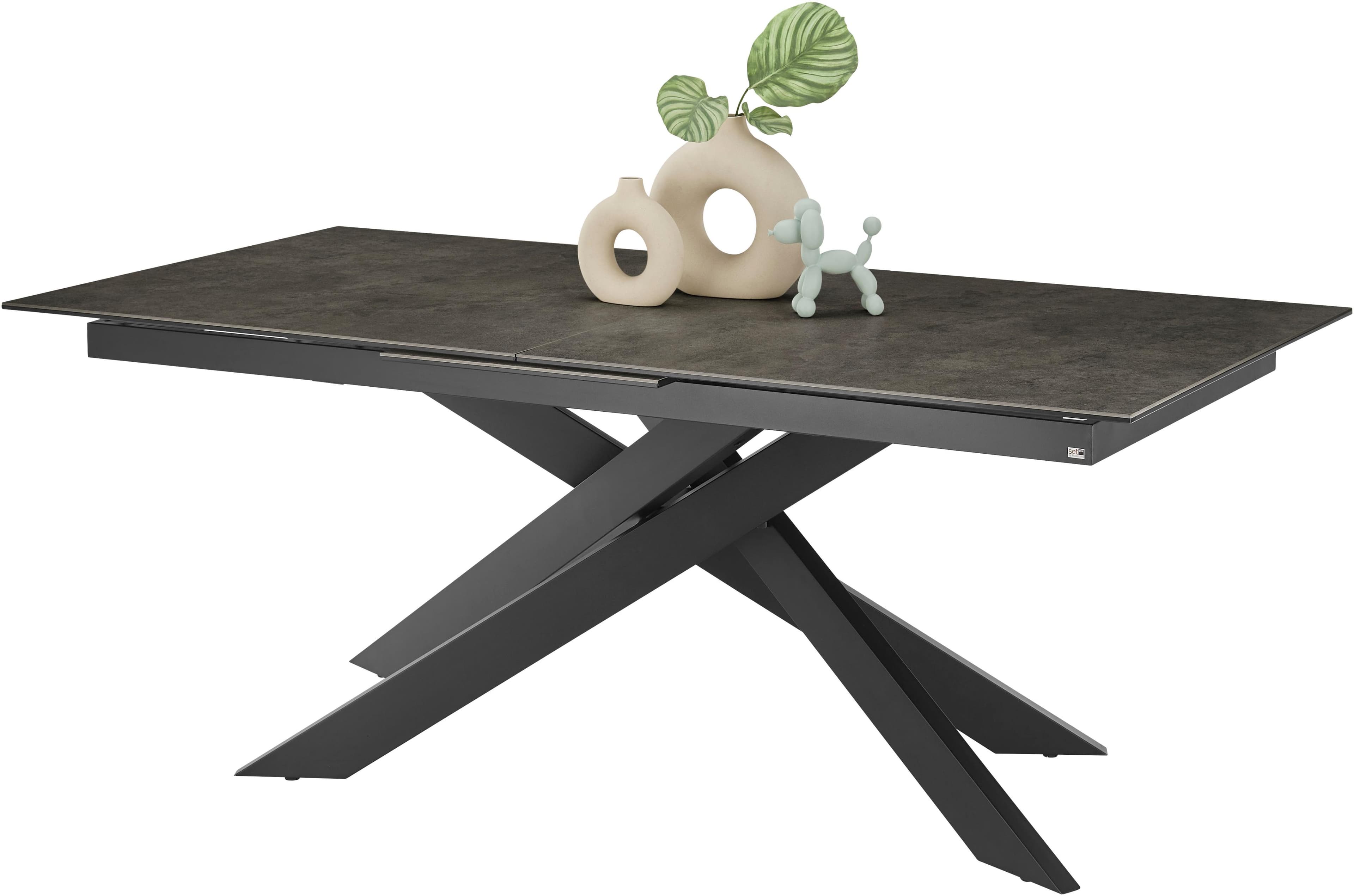 Ausziehbarer Esstisch Baltimore mit Glaskeramikplatte und schwarzem Kreuzfuß