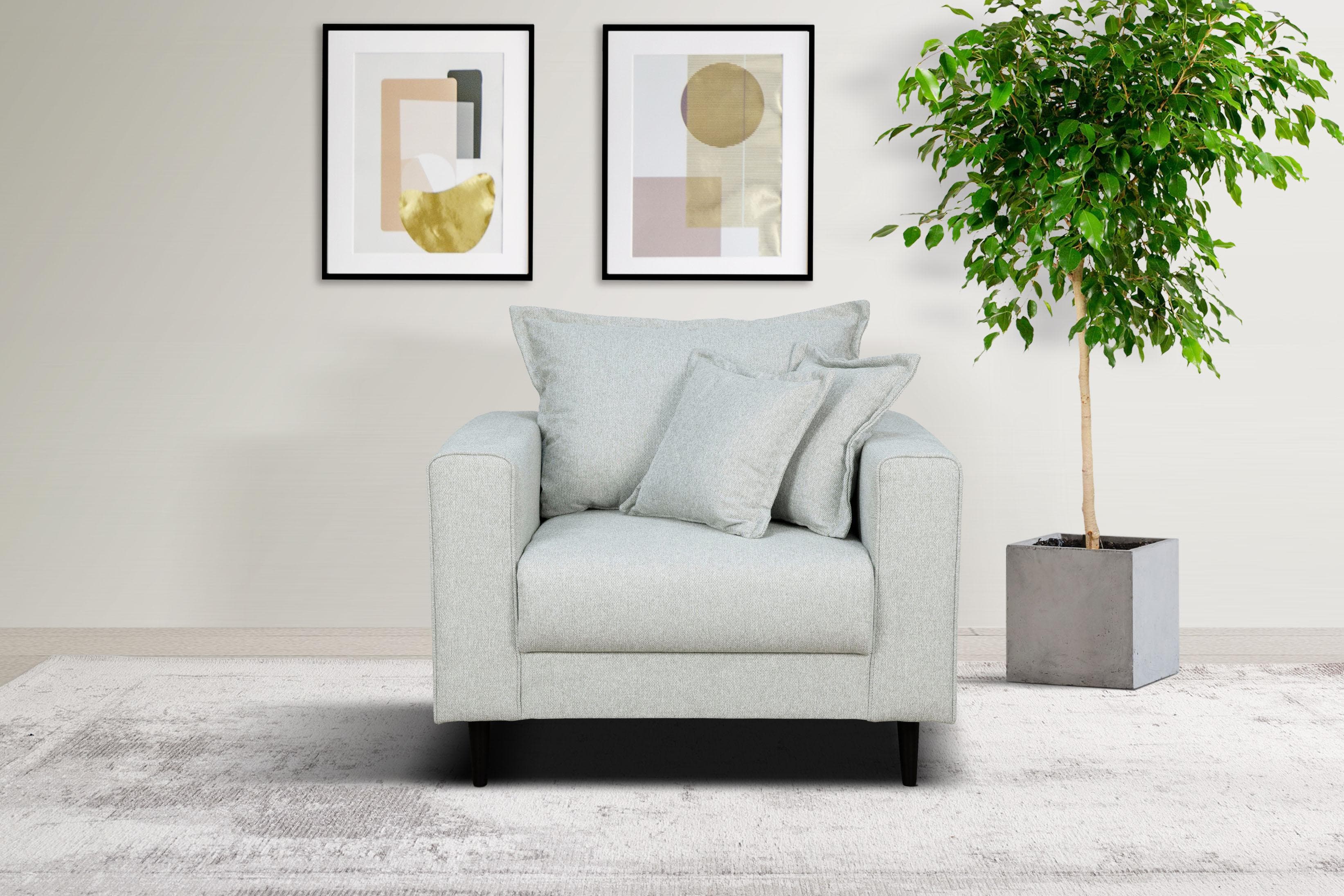 Gemütlicher Sessel mit Kederkissen und losem Rückenkissen