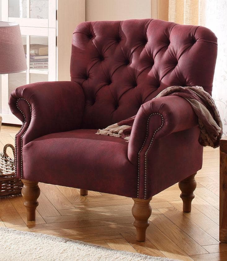 Chesterfield Sessel mit Knopfheftung und Ziernägeln