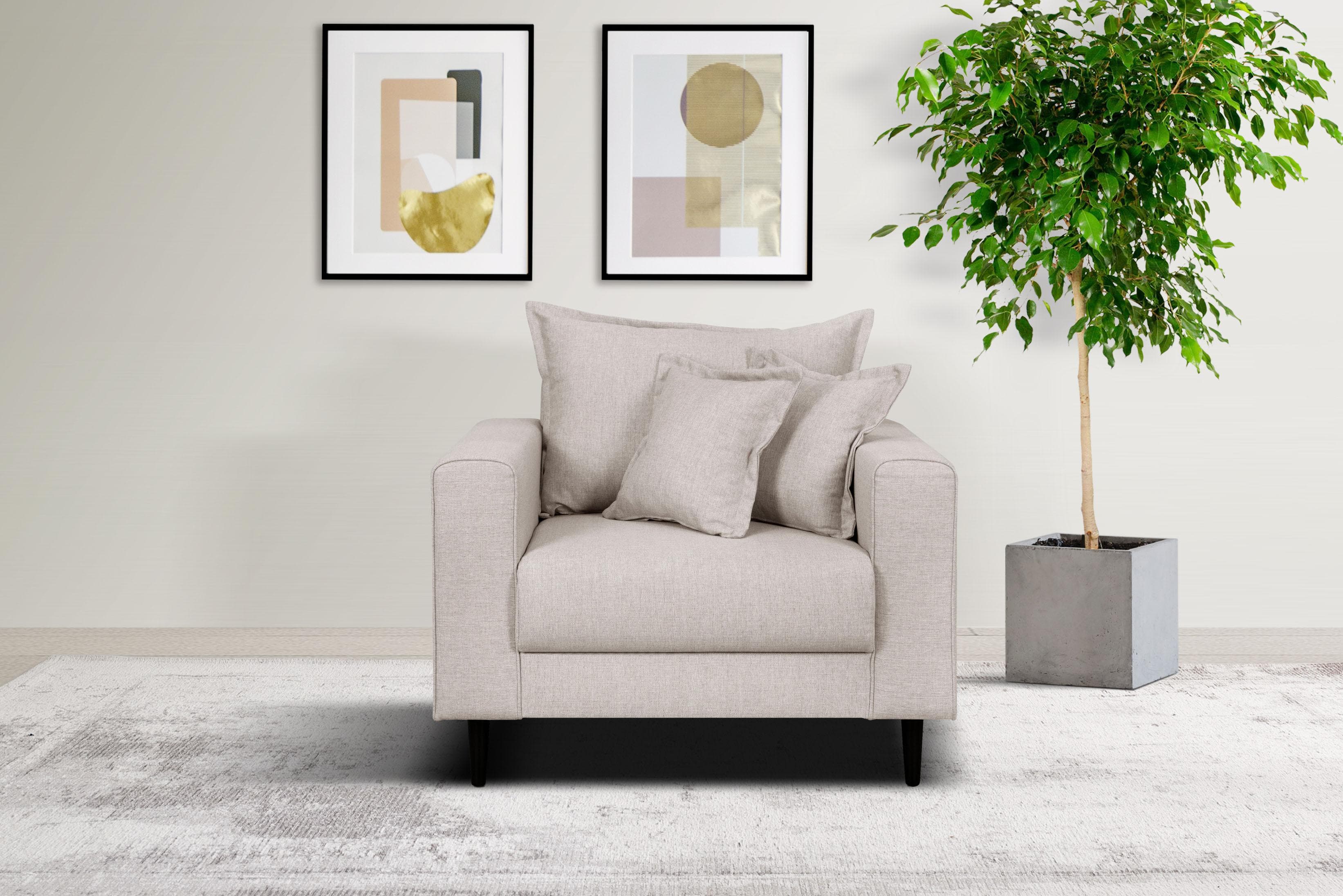 Gemütlicher Sessel mit Kederkissen und losem Rückenkissen