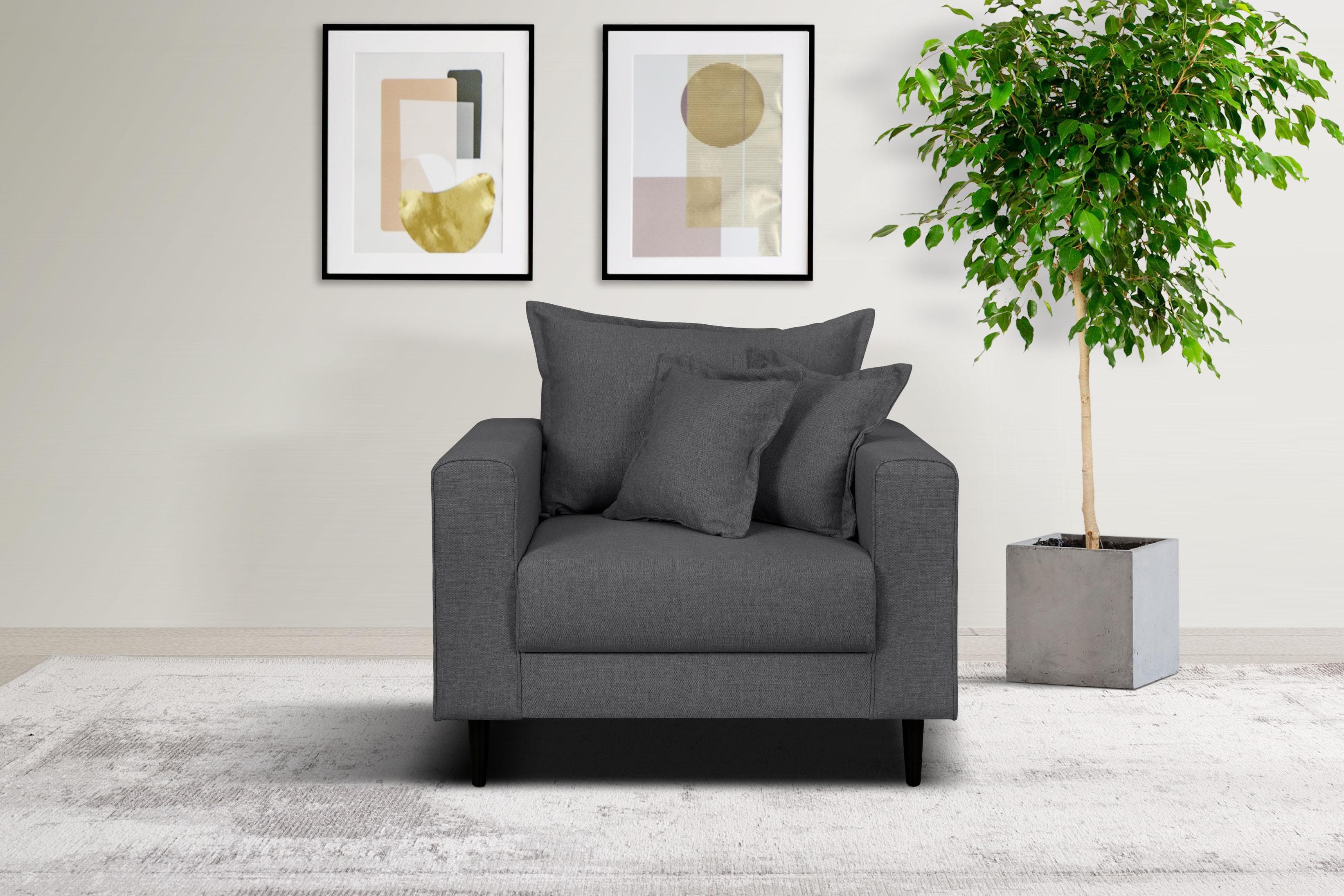 Gemütlicher Sessel mit Kederkissen und losem Rückenkissen