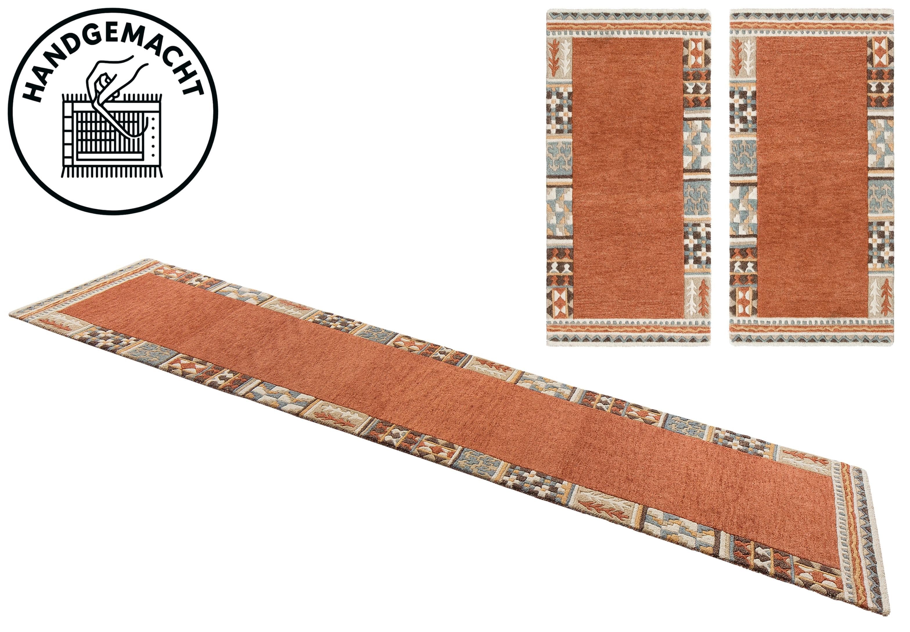 Handgearbeitete Bettumrandung aus Wolle in Orange
