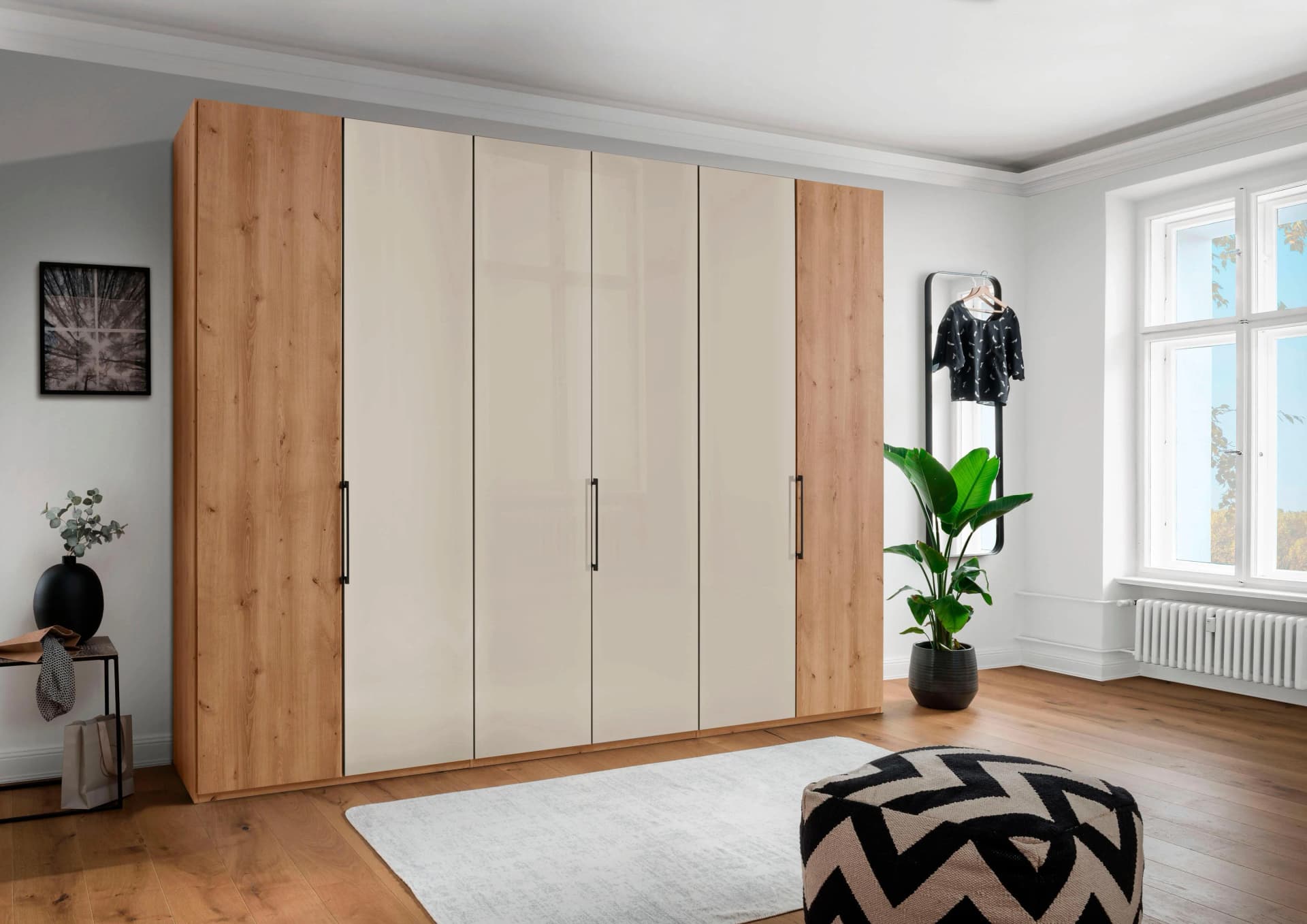 WIEMANN Monaco Falttürenschrank Bianco-Eiche Glas Champagner