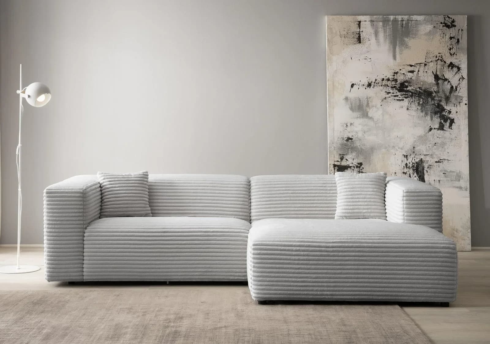 Ecksofa Bakels von Home Affaire in hellgrauem Cord mit Bouclé-Kissen und L-förmiger Ottomane