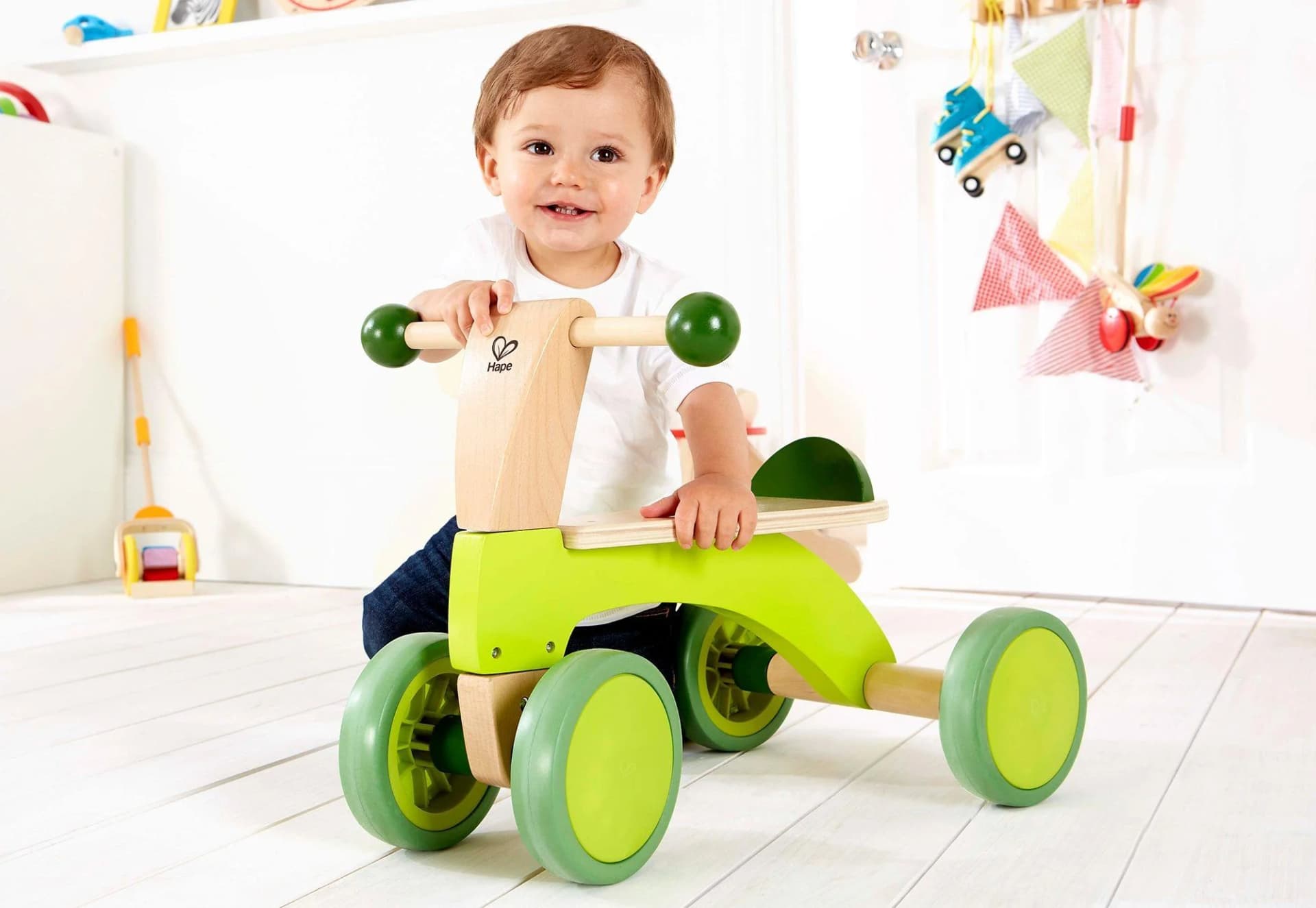 HAPE Rutschrad bunt Kinderfahrzeug aus Holz